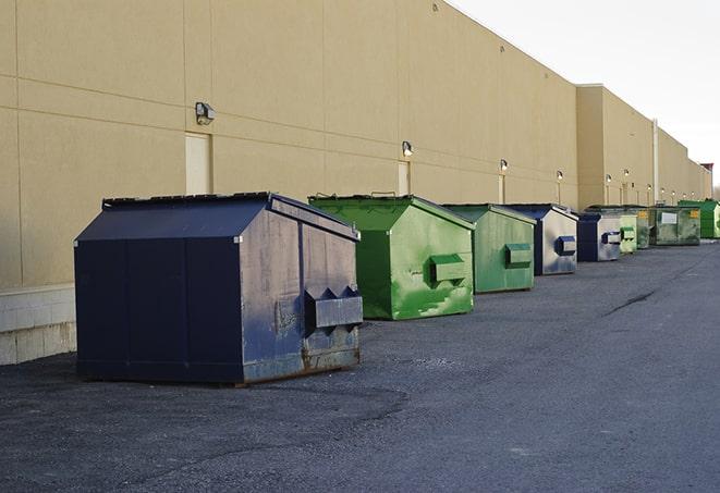 a stack of yellow construction dumpsters on a job site in Middletown